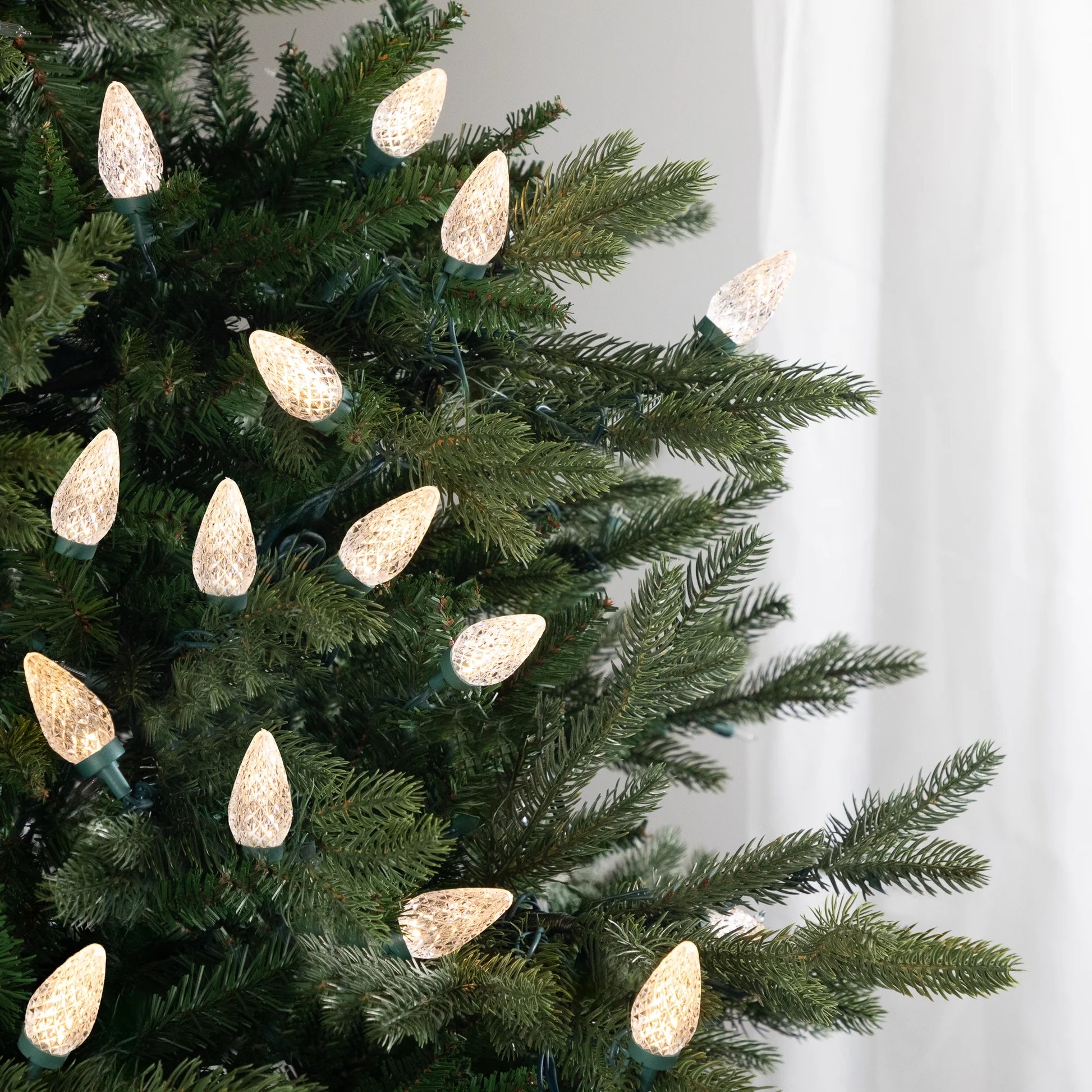 LED Faceted C9 Christmas Lights - Warm White - 66' Green Wire - 100Ct